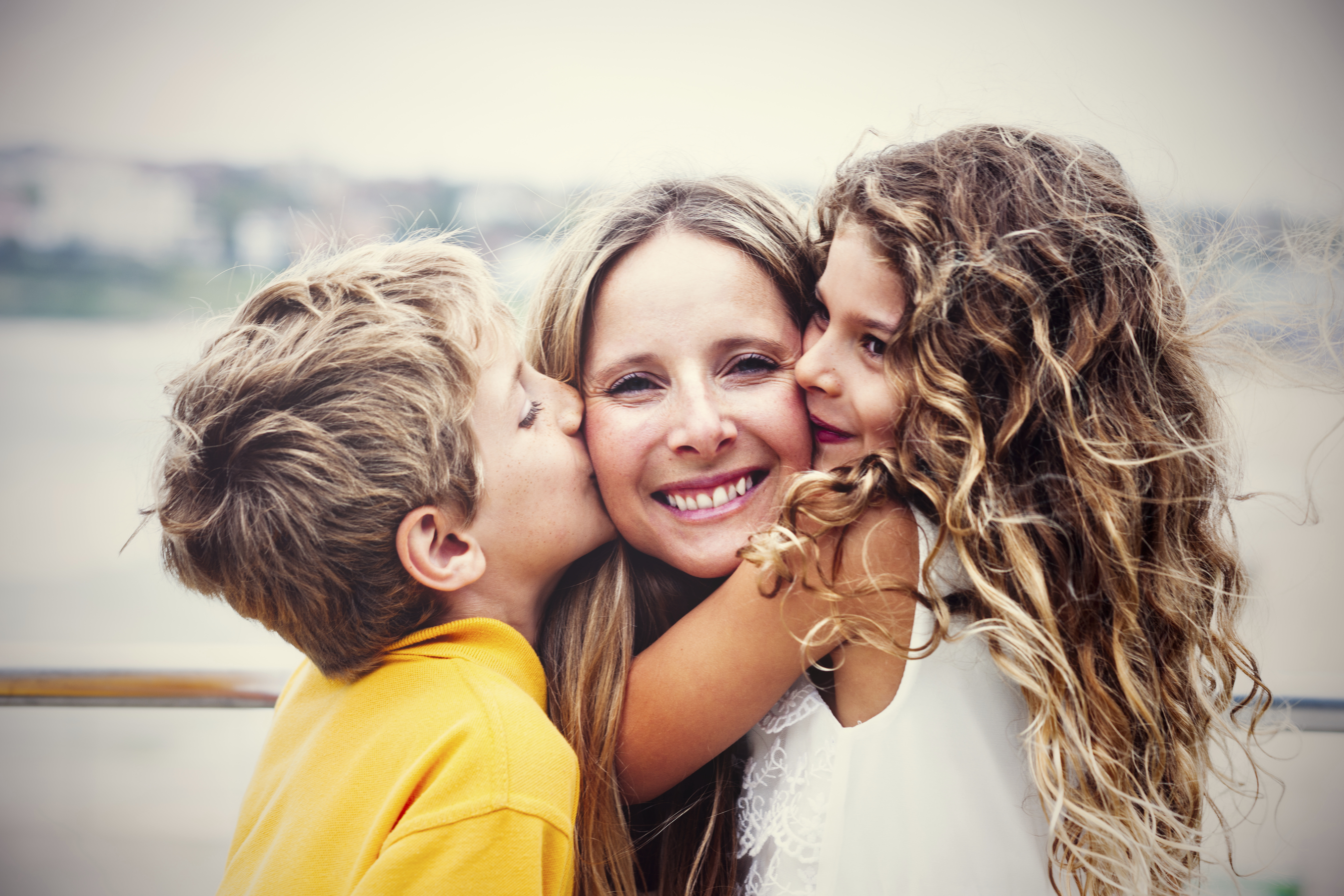 Real happy mother with her kids